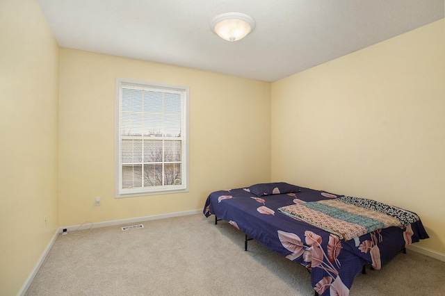 bedroom with light colored carpet