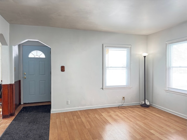 foyer entrance featuring light wood-type flooring and a wealth of natural light