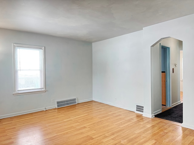 unfurnished room with light hardwood / wood-style flooring