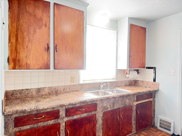 kitchen with sink, backsplash, and dark parquet floors