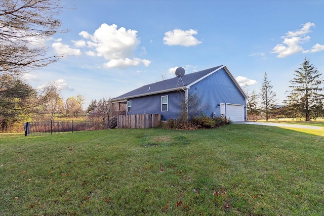 view of property exterior with a lawn and a garage