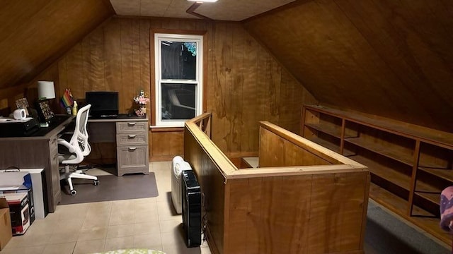 office space with lofted ceiling and wooden walls