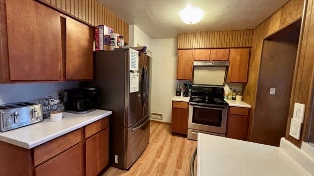 kitchen featuring light wood-type flooring and stainless steel appliances