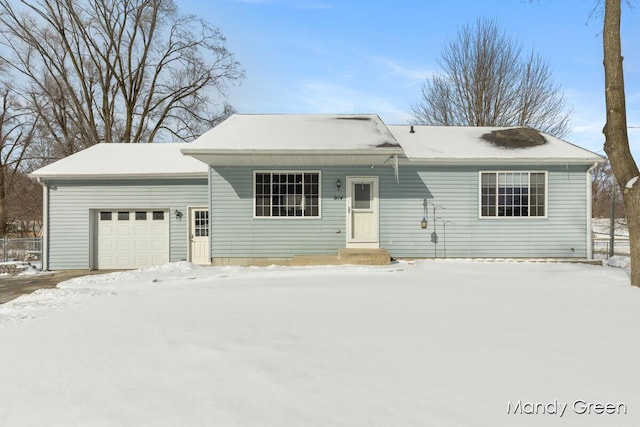 single story home featuring a garage