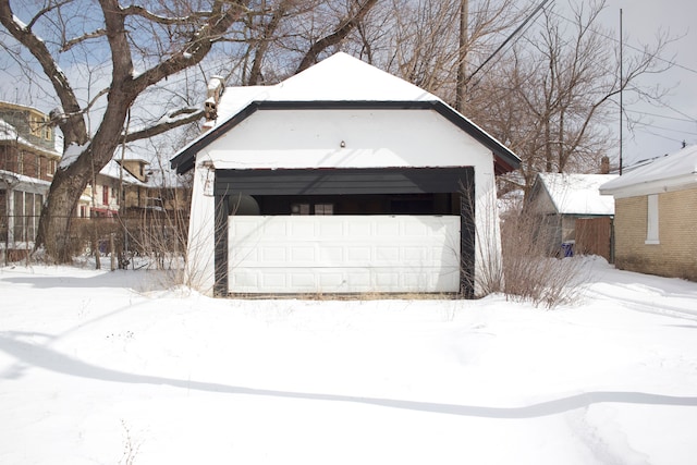 view of snow covered garage