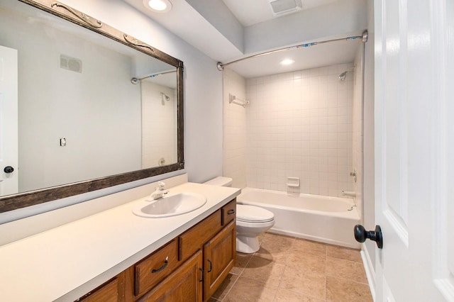 full bathroom featuring vanity, toilet, and tiled shower / bath