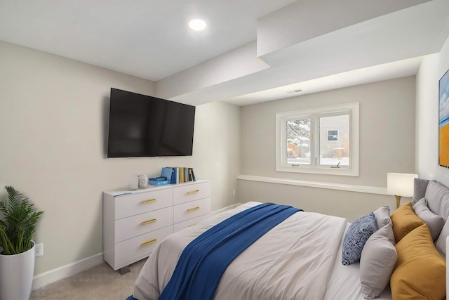 bedroom featuring light carpet