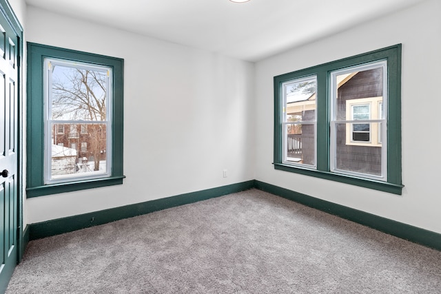 unfurnished room featuring carpet flooring