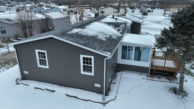 exterior space with a shingled roof, a residential view, crawl space, and a wooden deck