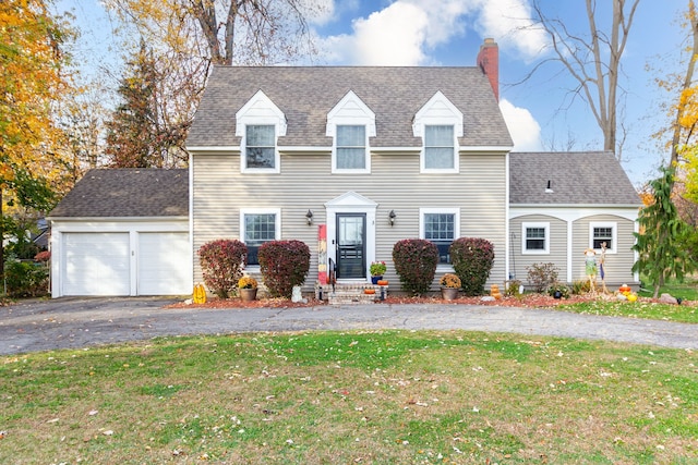 view of front facade with a garage and a front yard