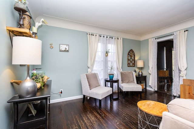 living area with hardwood / wood-style floors