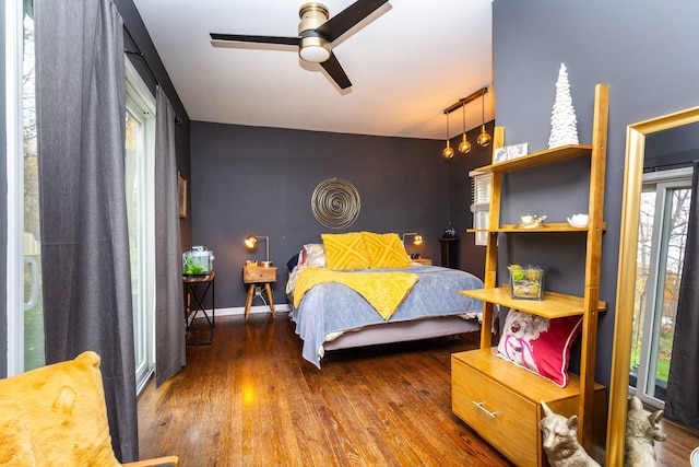 bedroom with dark hardwood / wood-style floors