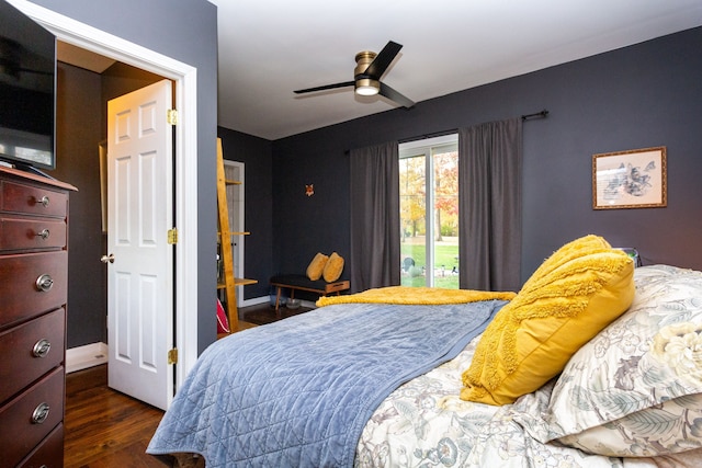 bedroom with dark hardwood / wood-style floors and ceiling fan