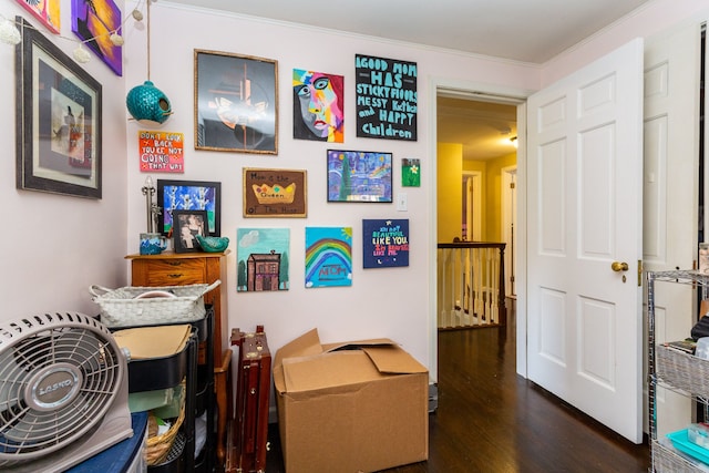 corridor with ornamental molding and dark hardwood / wood-style floors