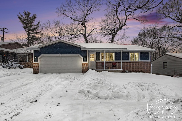 ranch-style home featuring a garage