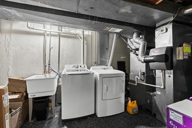 laundry area with sink and washer and dryer