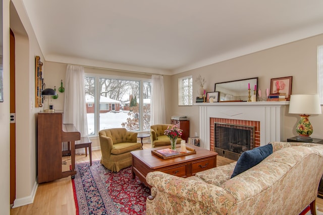 living room featuring a fireplace and light hardwood / wood-style flooring