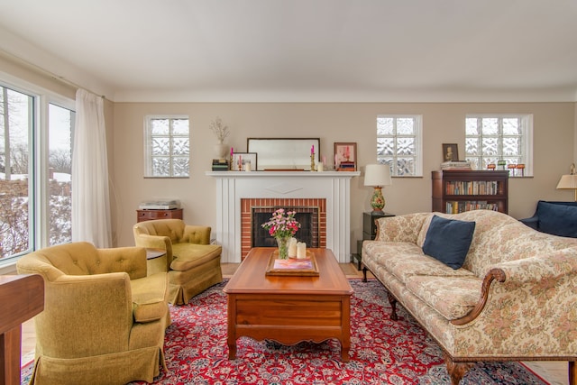 living room with a wealth of natural light and a fireplace