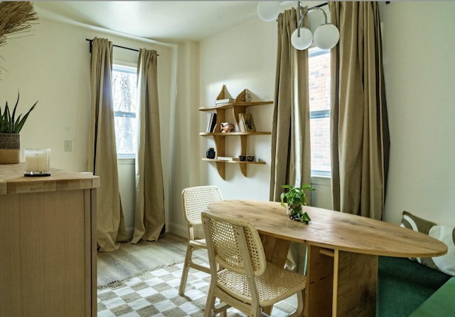 dining space with light hardwood / wood-style floors