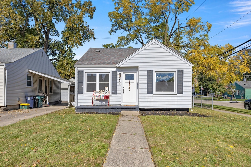 bungalow with a front lawn