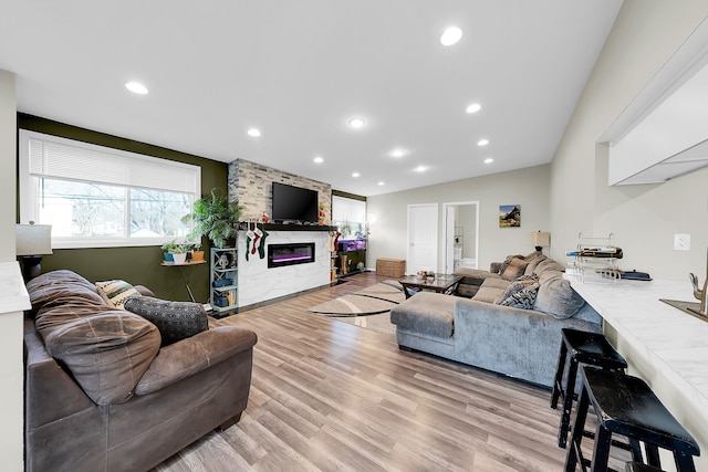 living room featuring a fireplace and light hardwood / wood-style floors