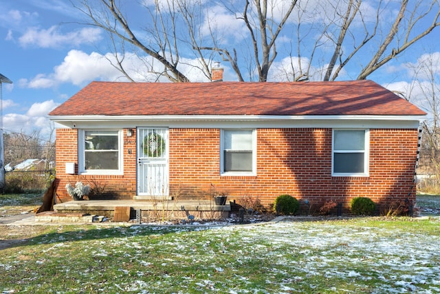 view of front of home with a yard