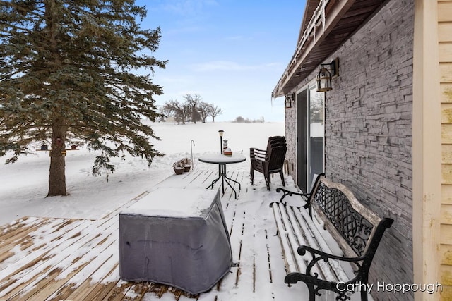 view of snow covered deck