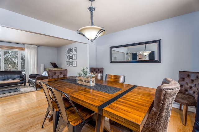 dining space with light wood finished floors