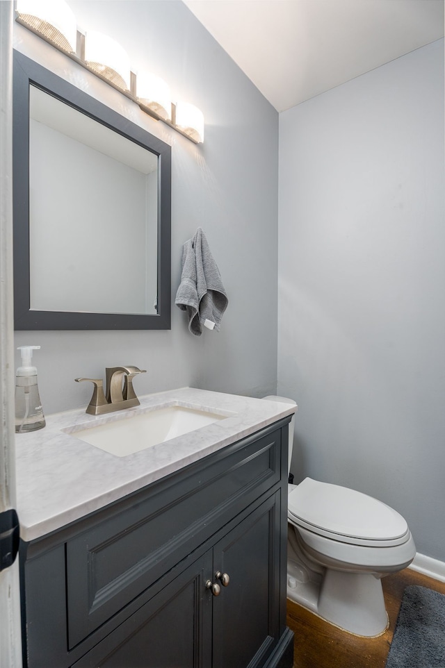 bathroom with vanity and toilet