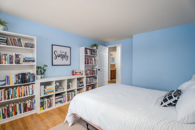 bedroom with wood finished floors