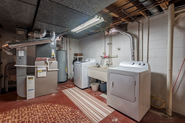 laundry room featuring heating unit, water heater, a sink, washer and dryer, and laundry area