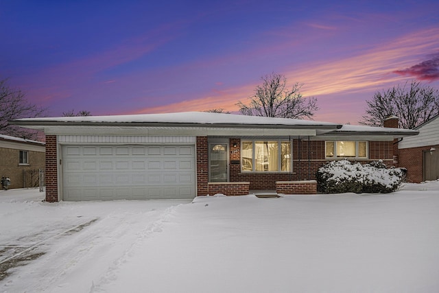 ranch-style house featuring a garage