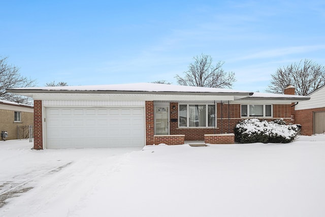 single story home featuring a garage