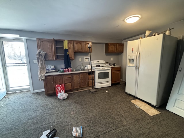 kitchen featuring sink and white appliances