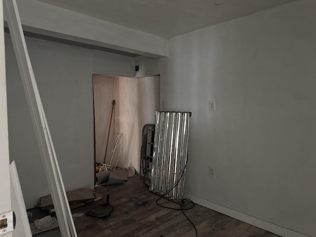 spare room featuring dark hardwood / wood-style floors