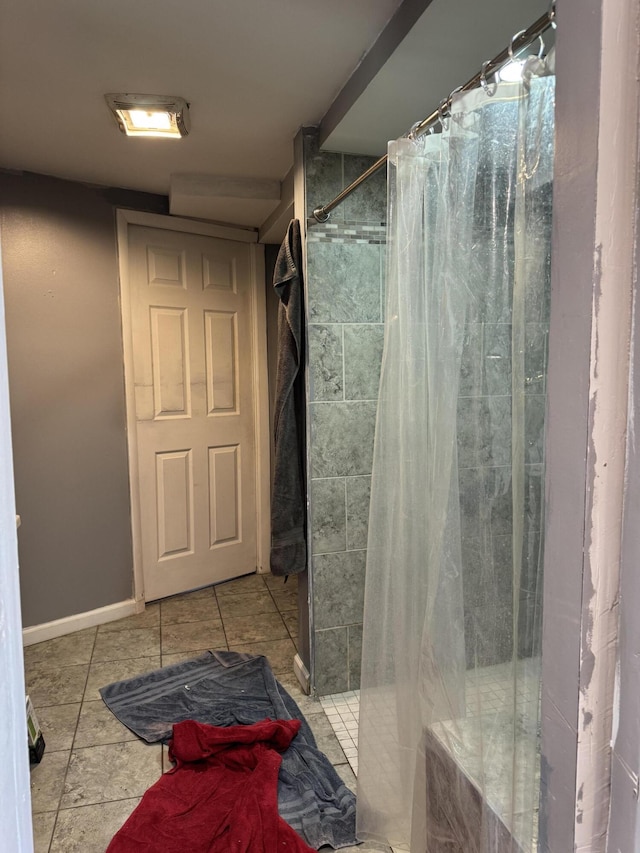 bathroom featuring tile patterned flooring and a shower with shower curtain