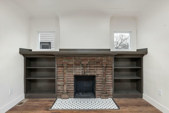 interior details with a fireplace and hardwood / wood-style floors