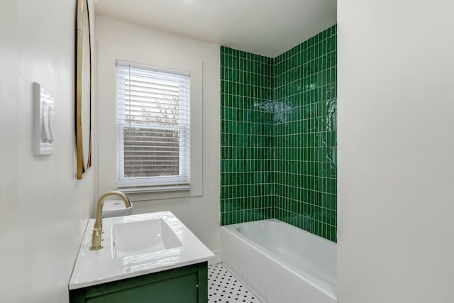 bathroom with vanity and tiled shower / bath combo