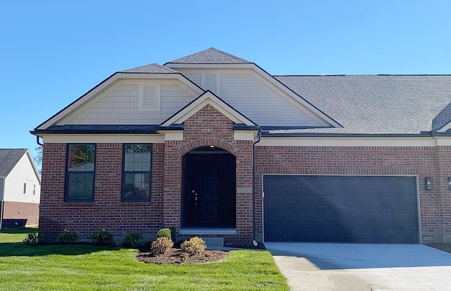 view of front facade with a front yard and a garage