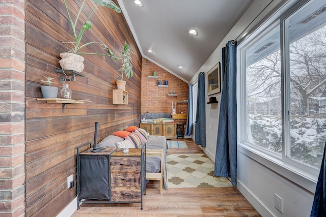 interior space with lofted ceiling, baseboards, recessed lighting, and wood finished floors