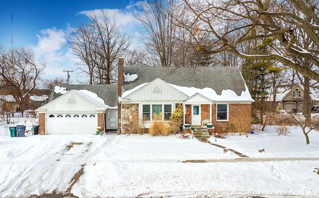 single story home with an attached garage, a chimney, board and batten siding, and brick siding