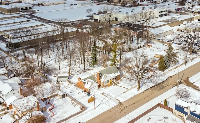 snowy aerial view featuring a residential view