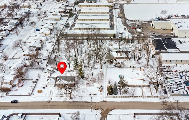 snowy aerial view with a residential view