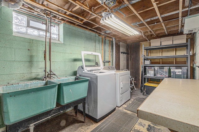 washroom featuring washer and dryer and sink