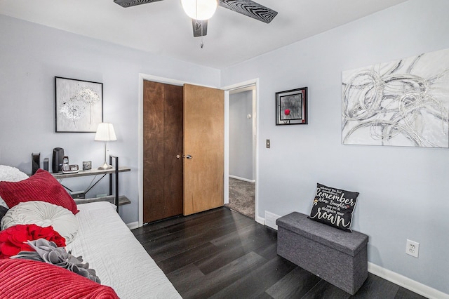 bedroom featuring dark hardwood / wood-style flooring and ceiling fan