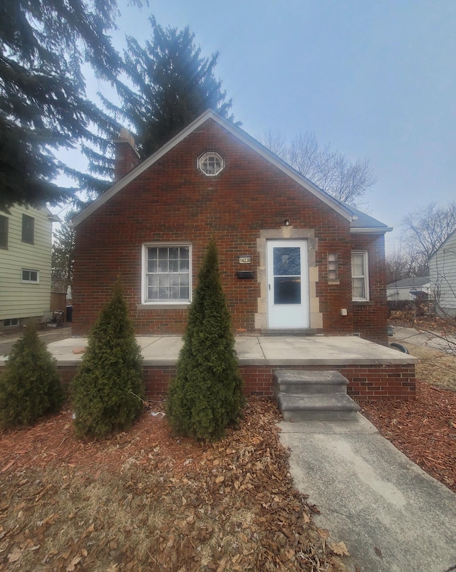 view of front of house with a patio area