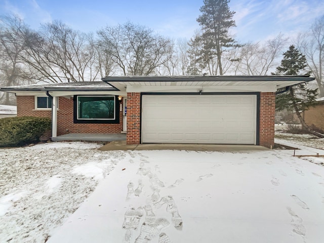 ranch-style house featuring a garage