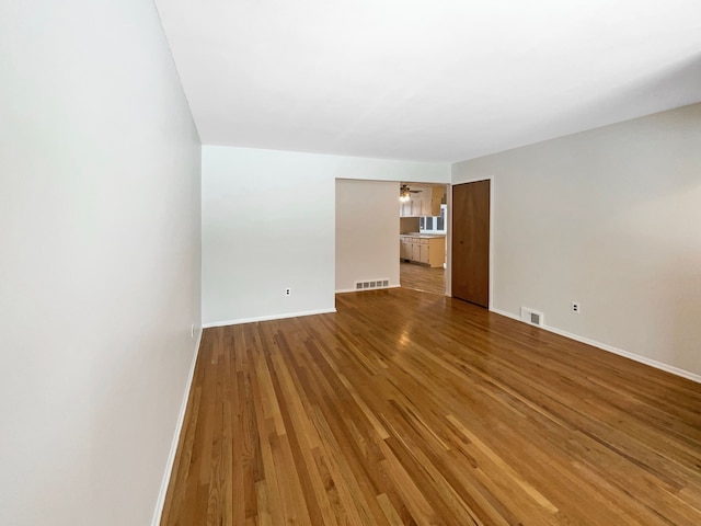 interior space with hardwood / wood-style flooring and ceiling fan