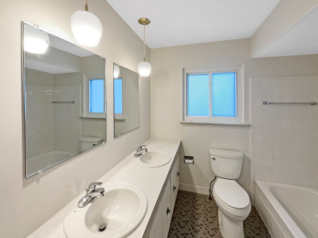 29743 Chelmsford Rd, Southfield, MI 48076 - full bathroom featuring double vanity, a sink, toilet, and baseboards