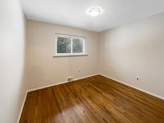 29743 Chelmsford Rd, Southfield, MI 48076 - spare room with visible vents, baseboards, and hardwood / wood-style flooring